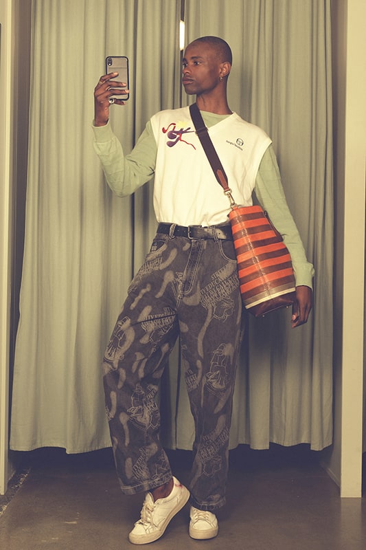 A person wearing a styled secondhand outfit from Goodbyes