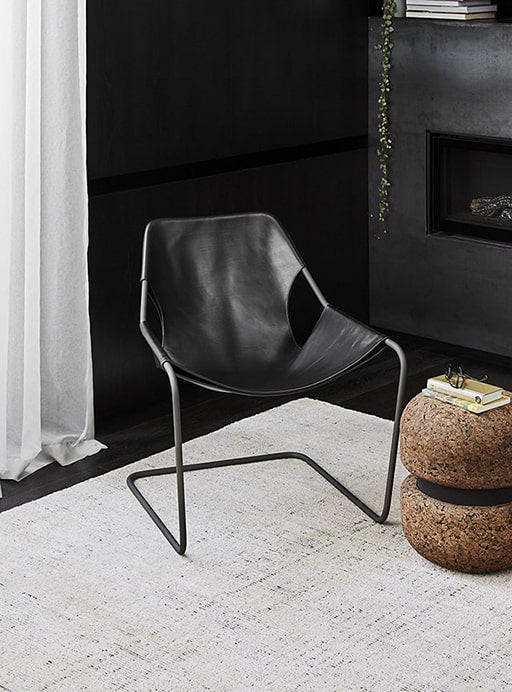 A black chair and home accessories from milk&sugar